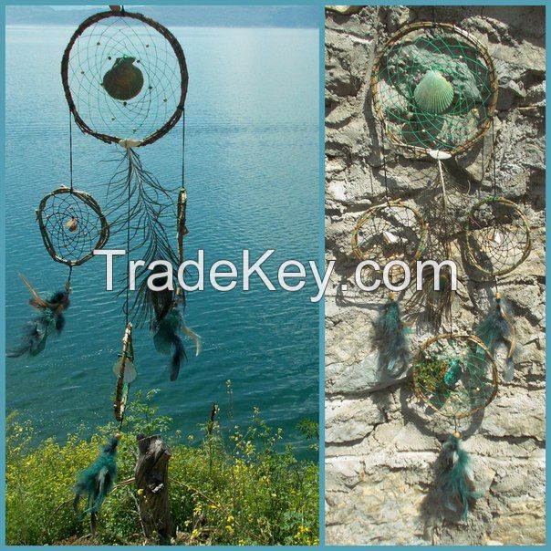 Handmade different models of dream catchers with shells, natural , peacock and art feathers 