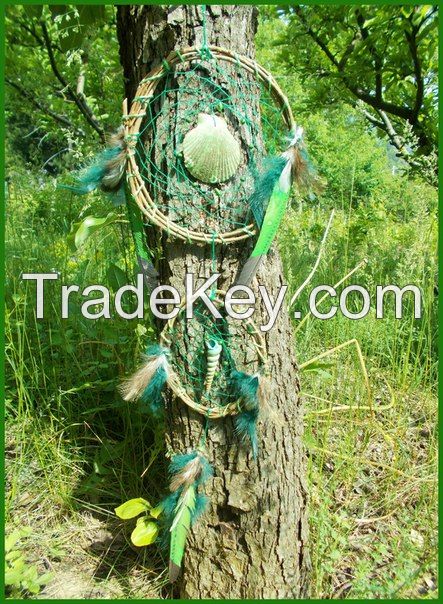 Handmade different models of dream catchers with shells, natural , peacock and art feathers