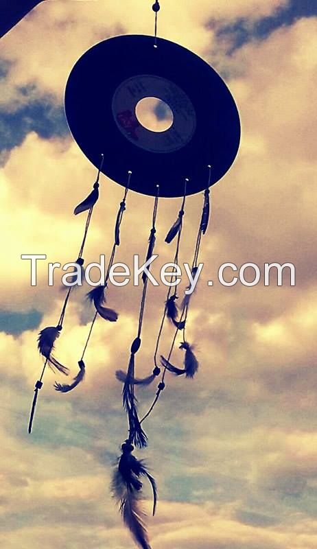 handmade dream catchers on music disks with natural featahers