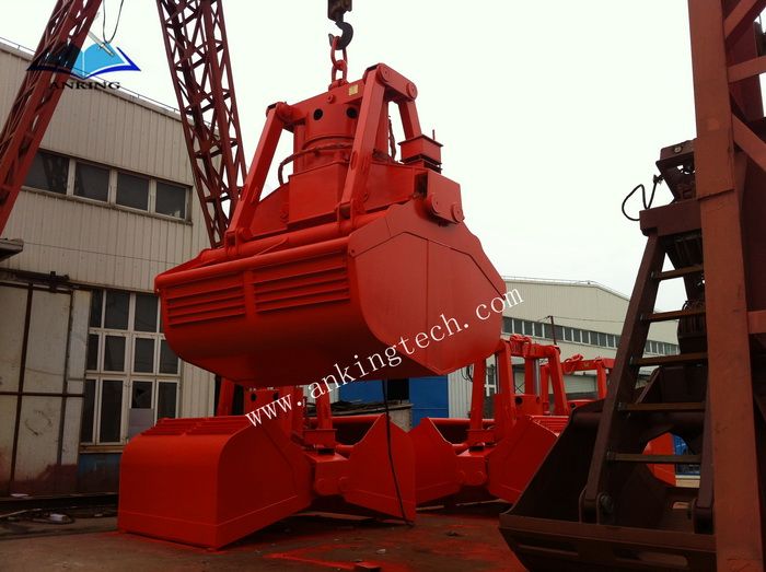 Electro-hydraulic clamshell grab for marine cargo ship