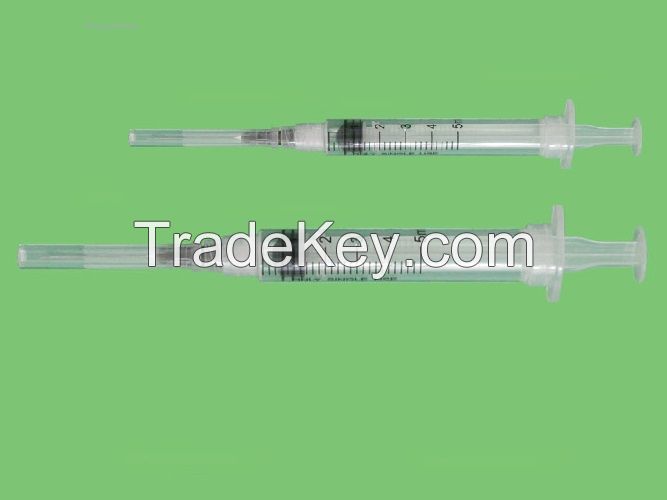 Disposable safety retraction syringe with needle