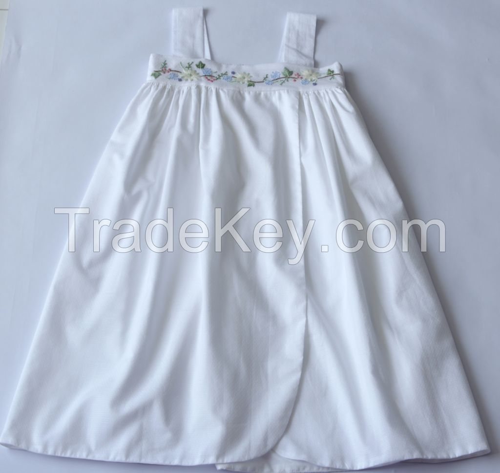 Hand smocking and embroidery in cotton & linen.