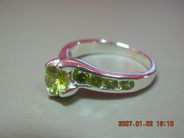 sterling silver with bottle grren cz