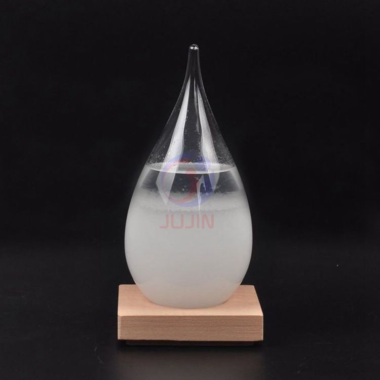 Different size glass storm with wooden basement barometer bottle weather forecast bottle