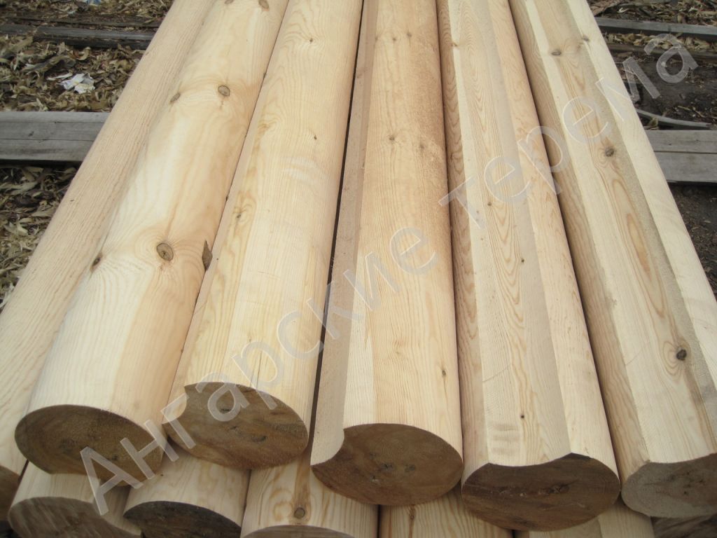 Machine rounded (cylindrical) logs for house construction