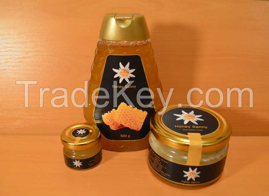 High quality honey in barrels and glass jars