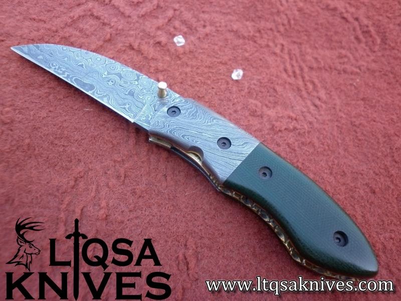 Custom made Damascus steel folding knife