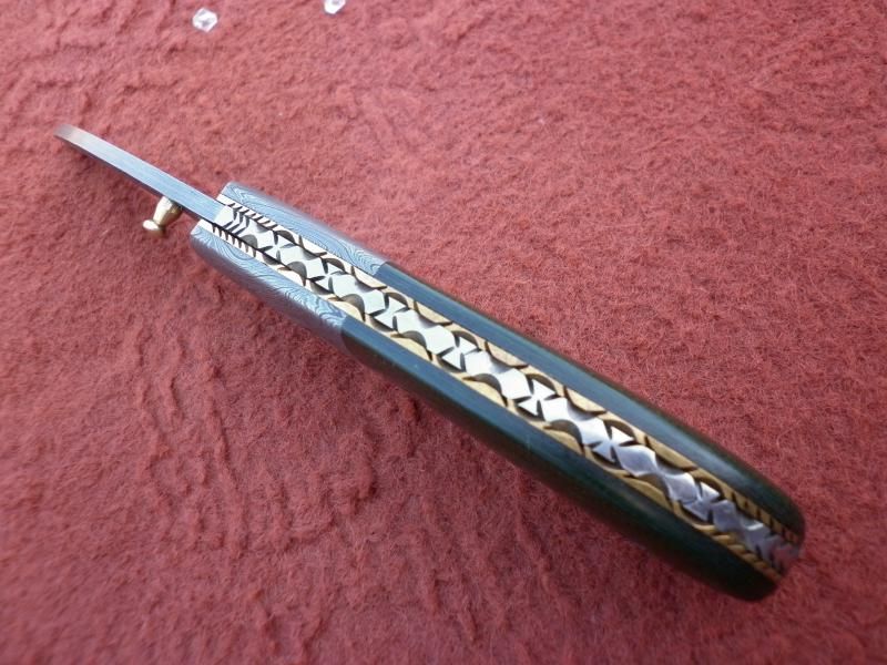 Custom made Damascus steel folding knife