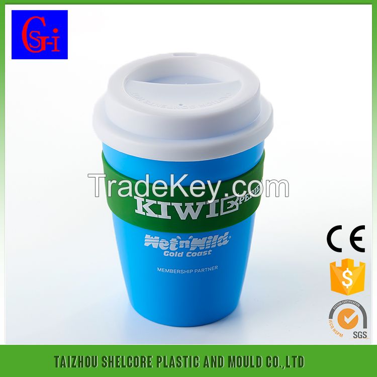 Plastic coffee cup with lid and silicone sleeve