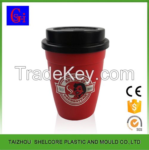 Plastic coffee cup with lid and silicone sleeve