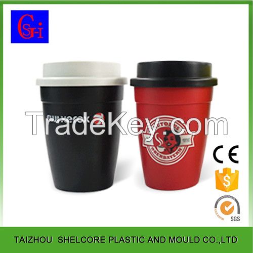 Plastic coffee cup with lid and silicone sleeve