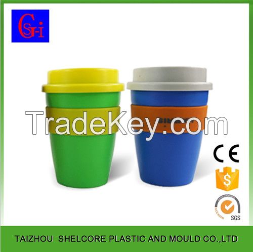 Plastic coffee cup with silicone sleeve