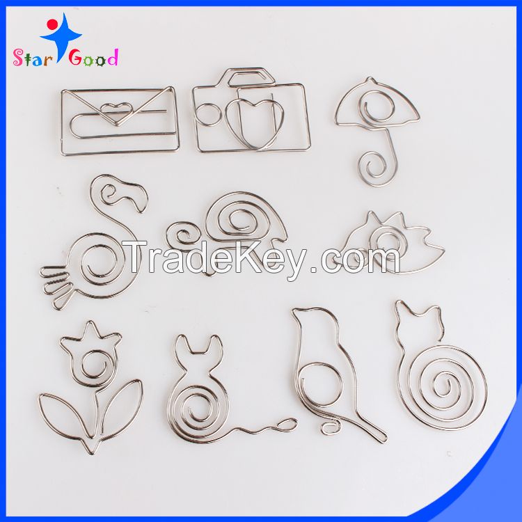 assorted silver matel animal paper clips