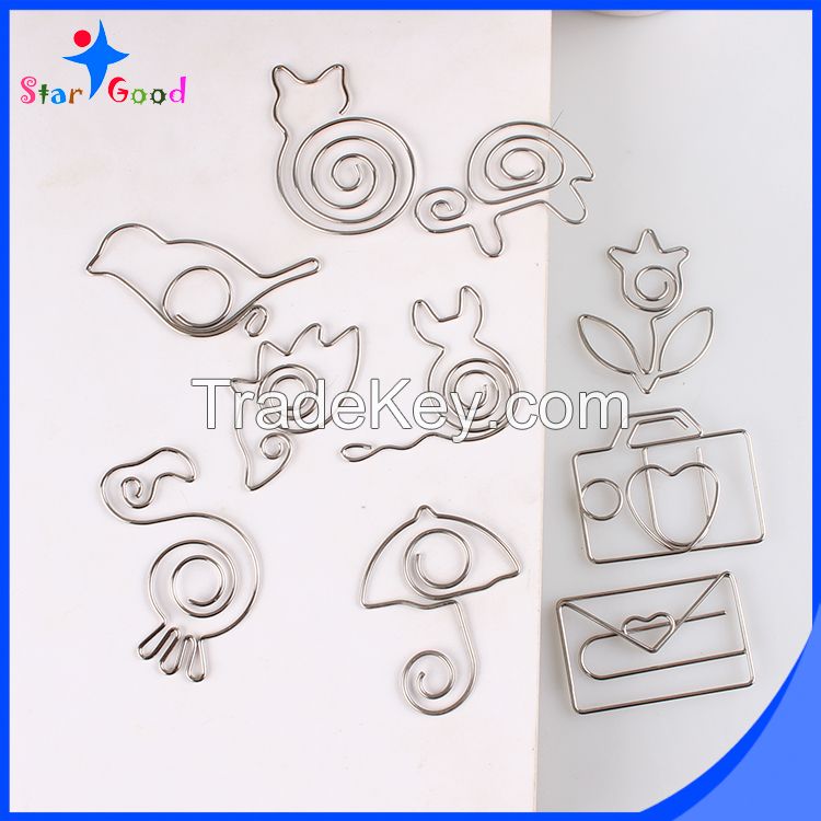 assorted silver matel animal paper clips