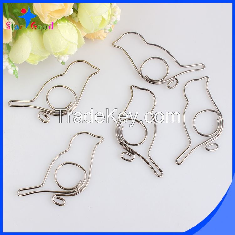 assorted silver matel animal paper clips