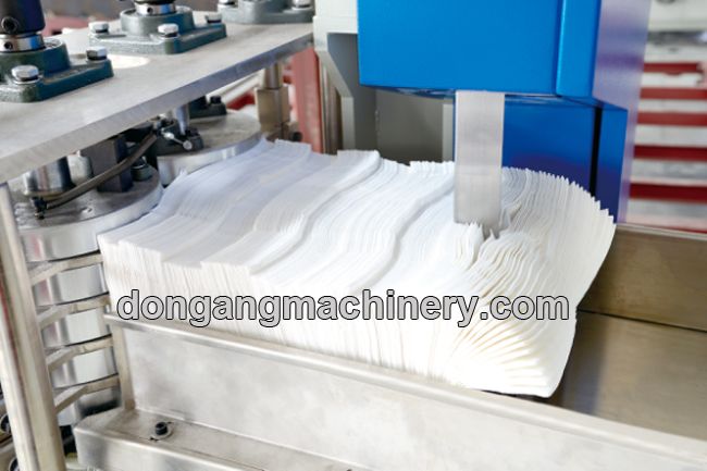 Napkin paper folding machine