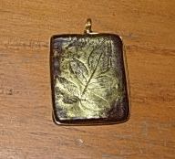 Wire wrapped embossed Polymer clay Pendant