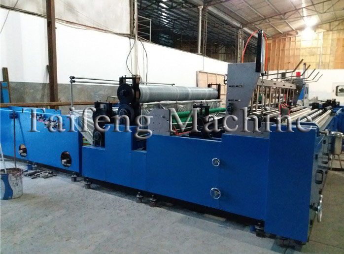 Automatic rewinding and perforating paper machine