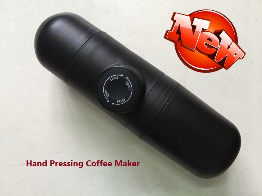 HAND PRESSING COFFEE CUP