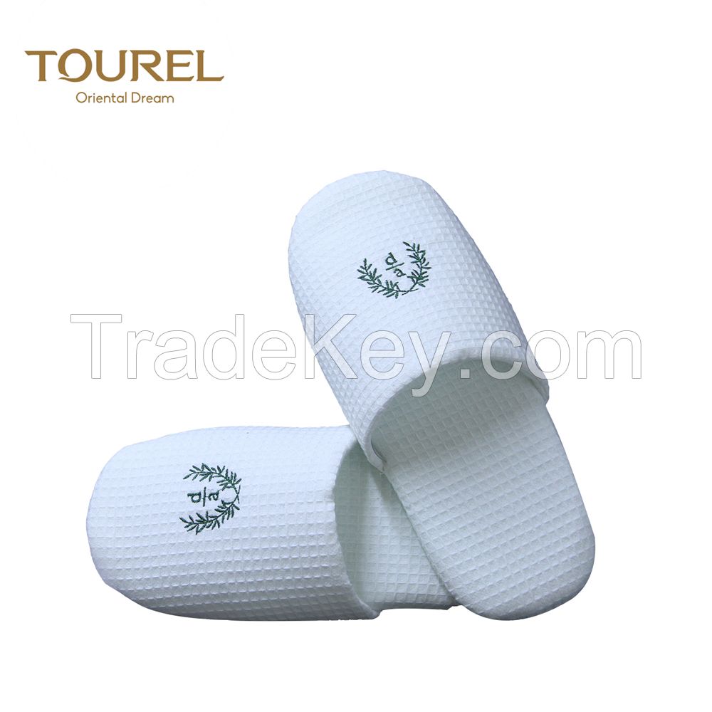 Wholesale disposable coral fleece hotel slippers with customized embroidery