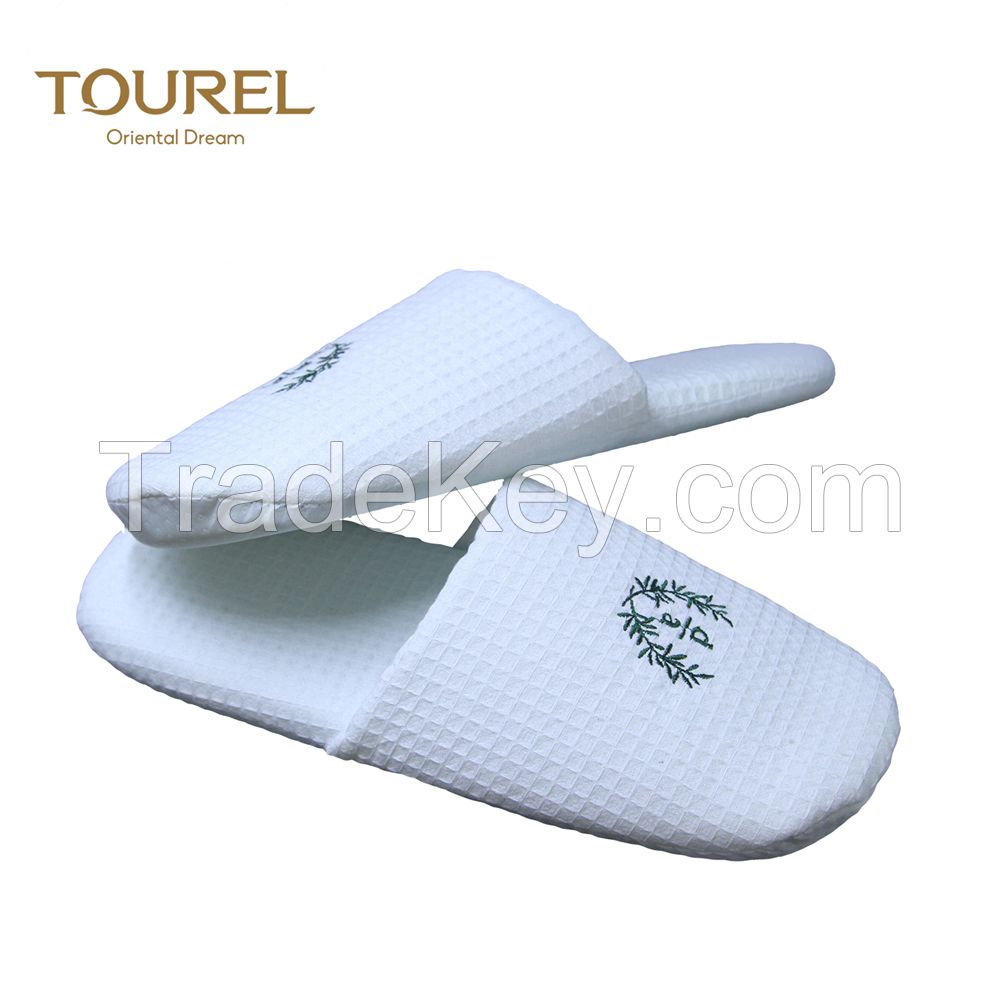 Wholesale disposable coral fleece hotel slippers with customized embroidery