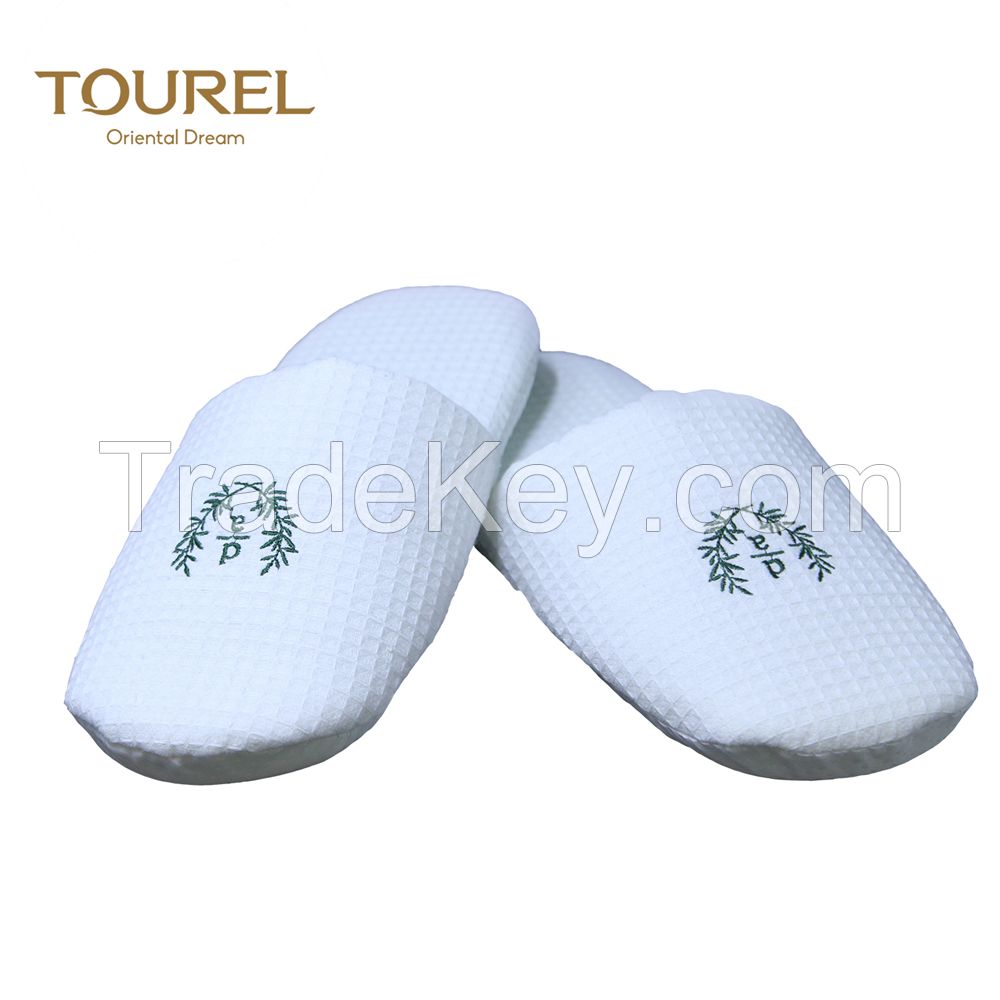 white personalised hotel slipper with closed toe style
