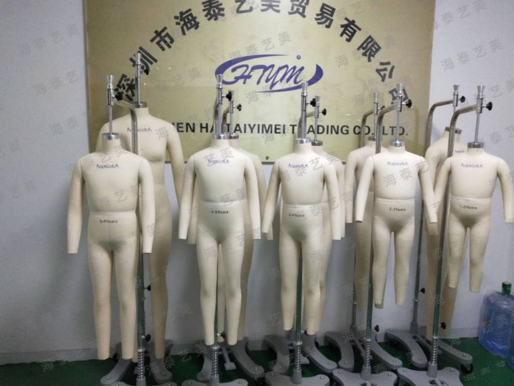 children fitting mannequin for garment tailoring