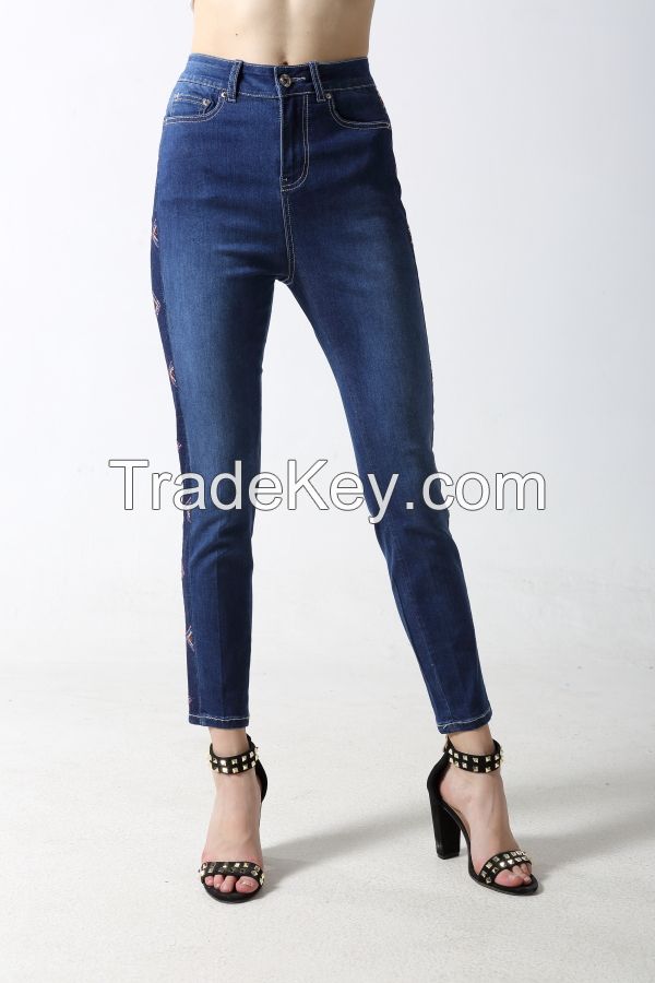 Woman's skinny dneim jeans with dark side with rhinestones