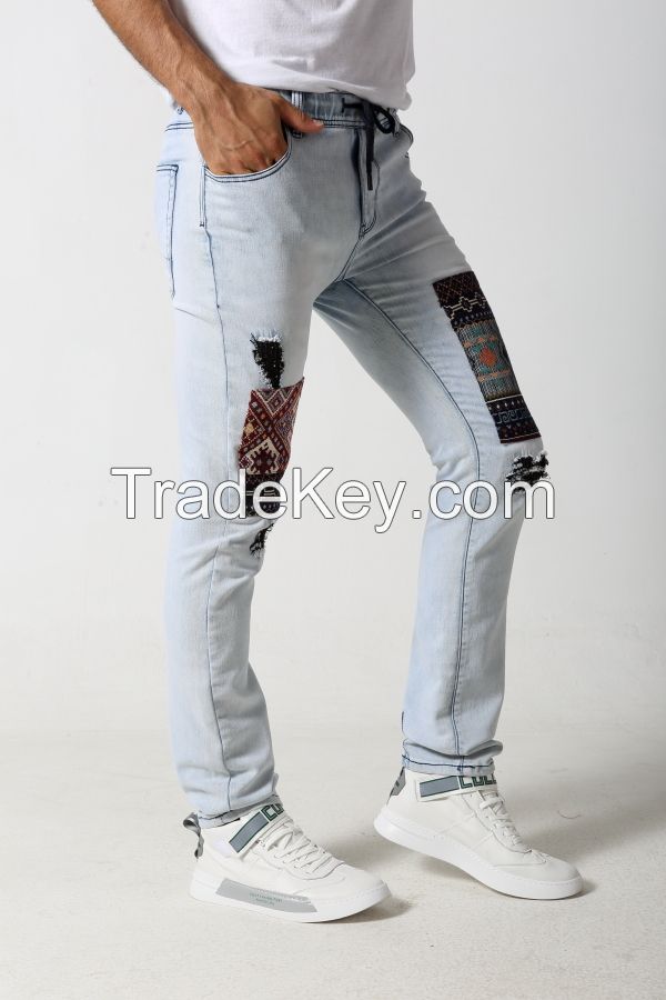 Men's slim distressed denim jeans with jacquard patches