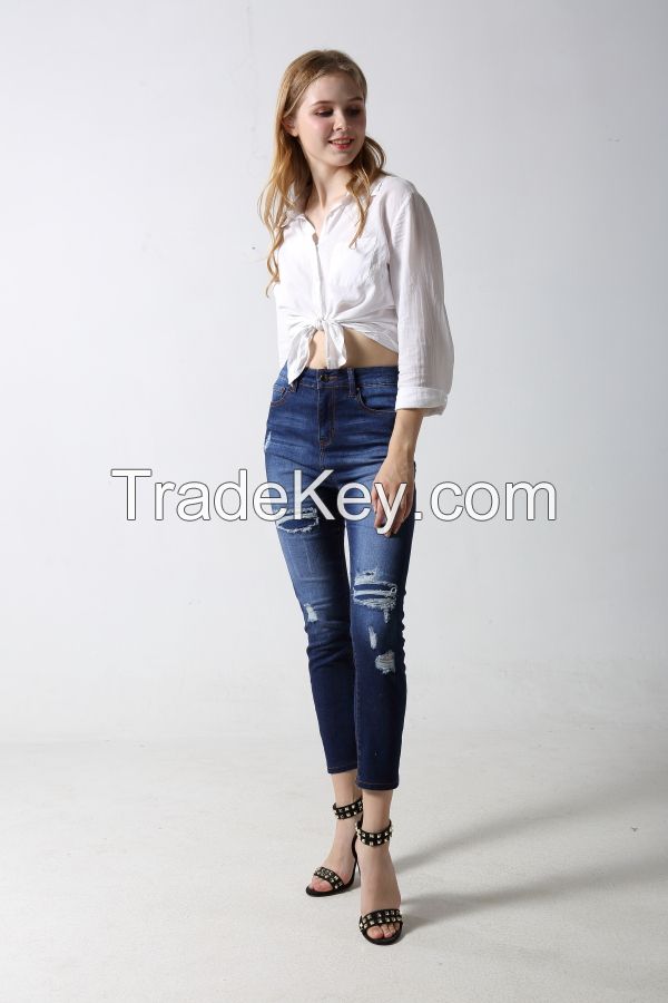 Woman's Slim denim jeans with rips and distressed patches