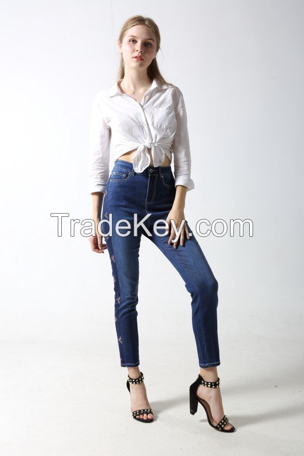 Woman's skinny dneim jeans with dark side with rhinestones