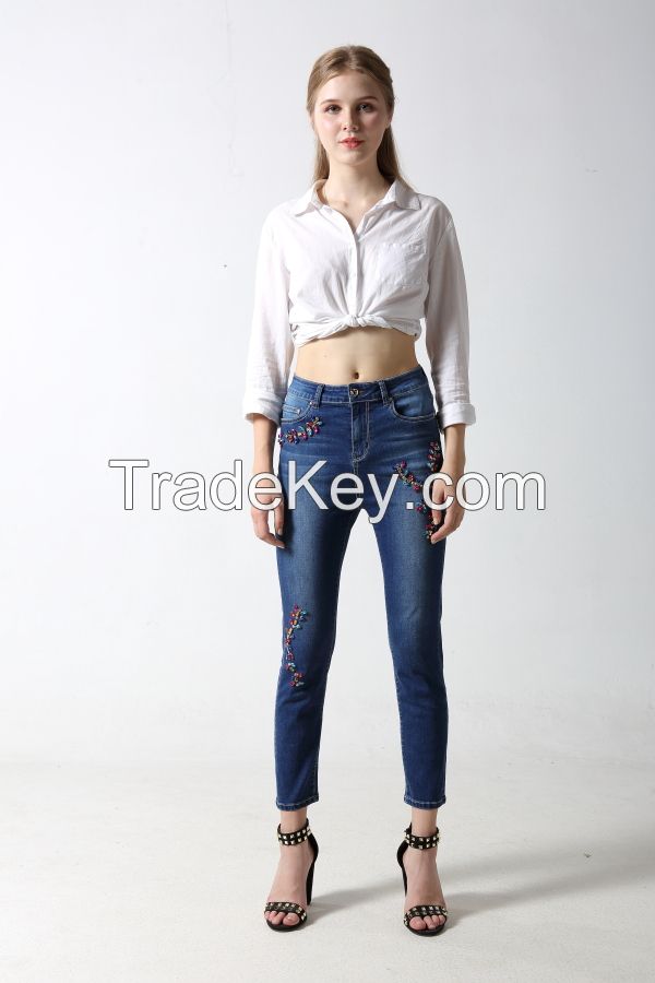 Woman's slim denim jeans with sparkling