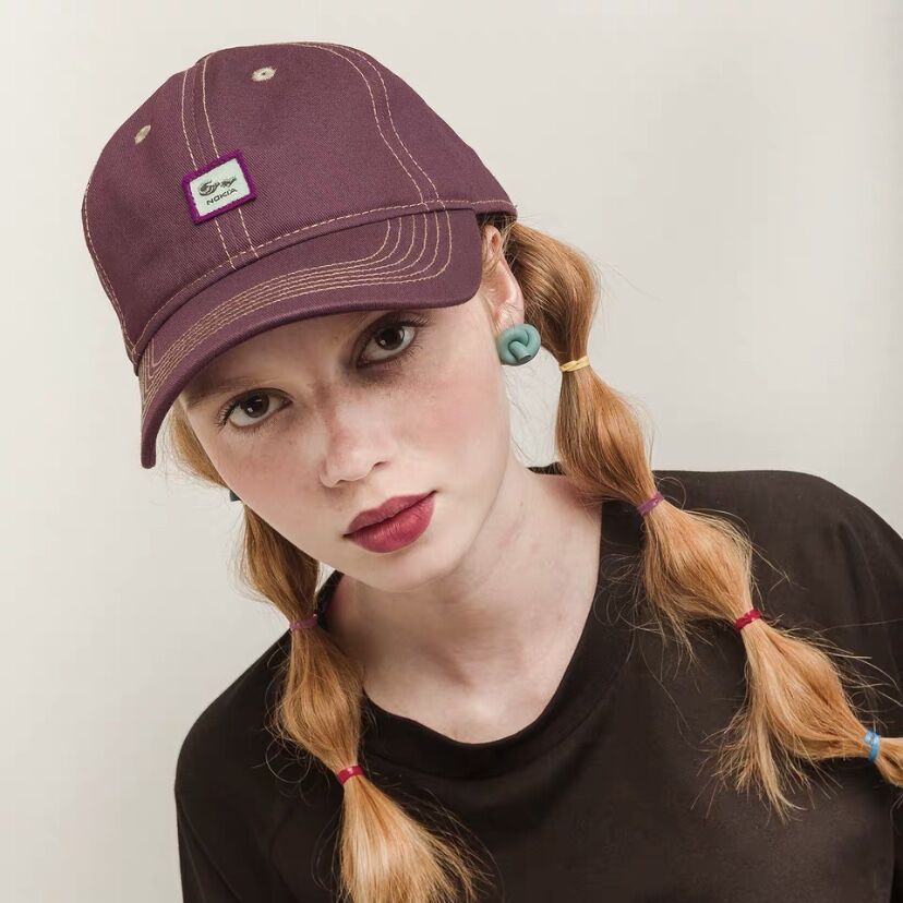 purple baseball cap