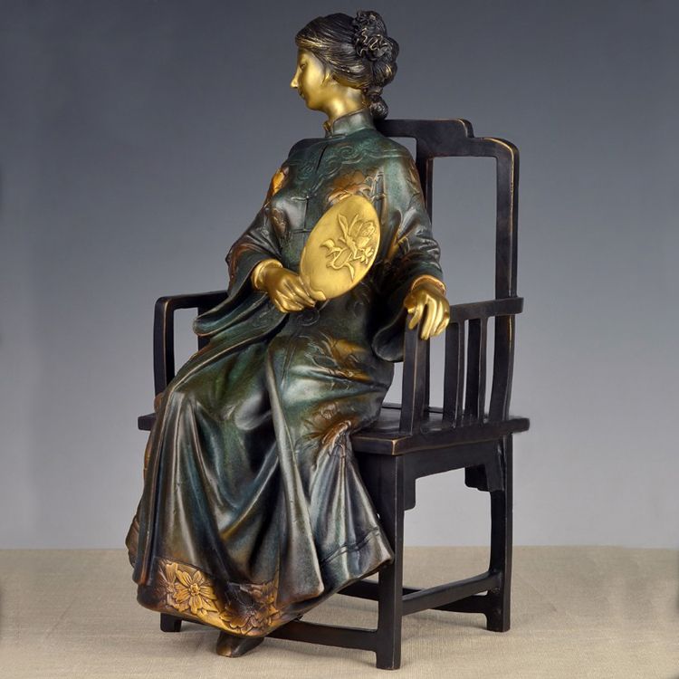 A set of four stylized modern bronze statues of me, a bronze statue of a Chinese woman,