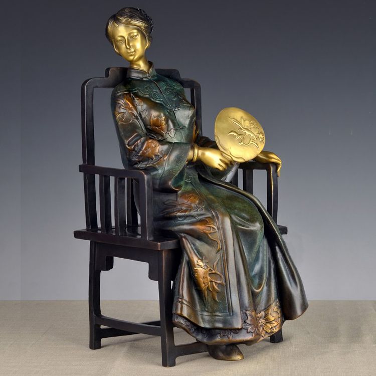 A set of four stylized modern bronze statues of me, a bronze statue of a Chinese woman,