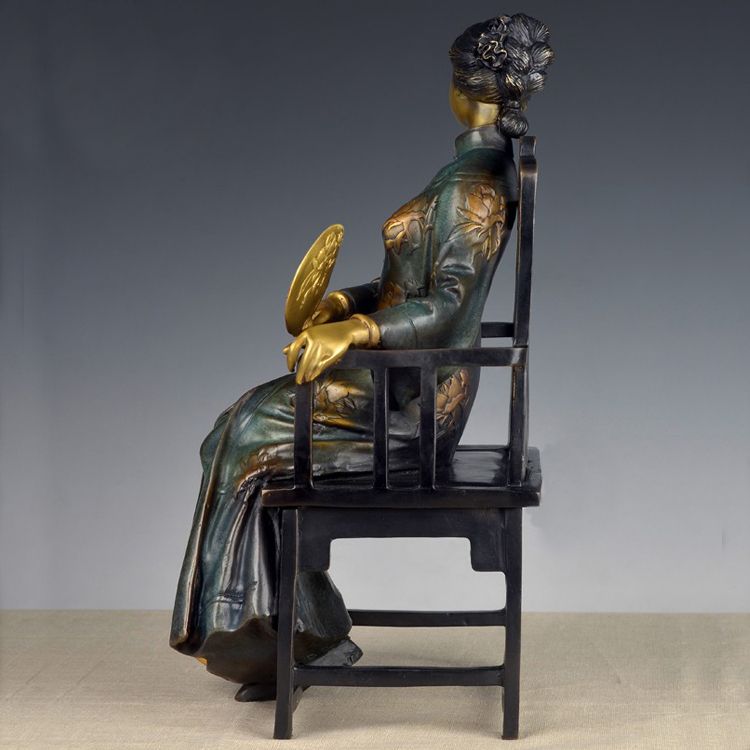 A set of four stylized modern bronze statues of me, a bronze statue of a Chinese woman,