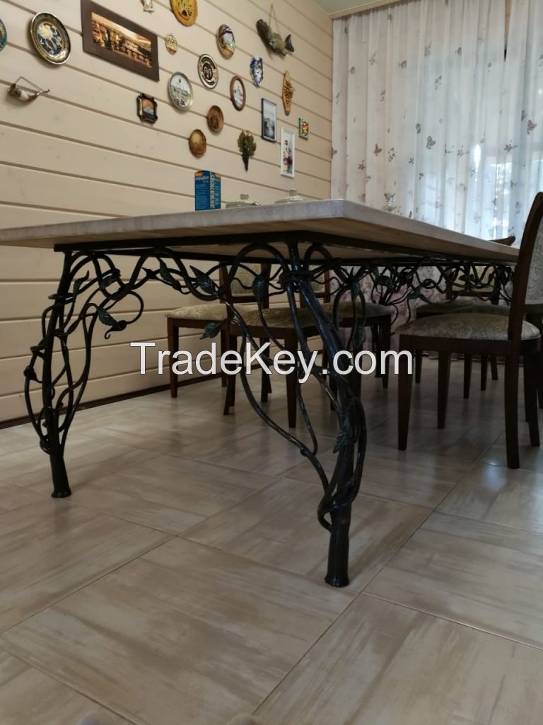 Tables made of wood and resin with forged underframes