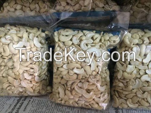 Whole large cashews are removed from the shell and inspected for freshness-Raw