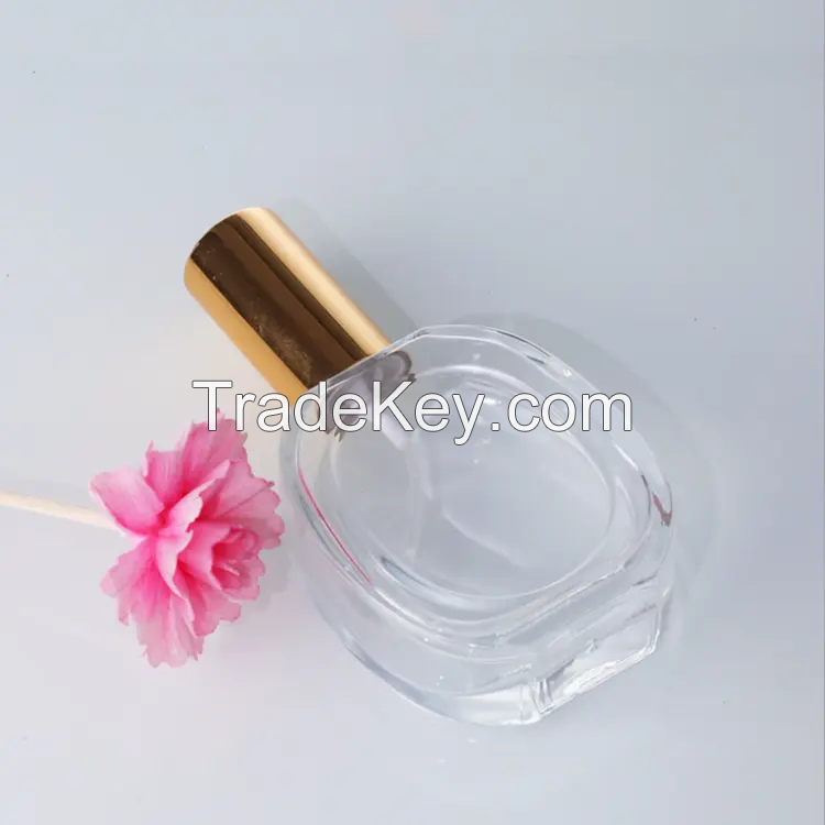 50ml Transparent Oval Shape Perfume Bottle Mist Spray Top Glass Bottle with Golden Sliver Lid