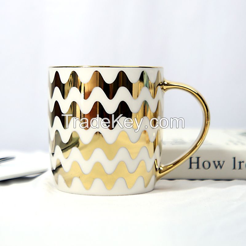 Gold Handle Coffee Mug with Geometric Design