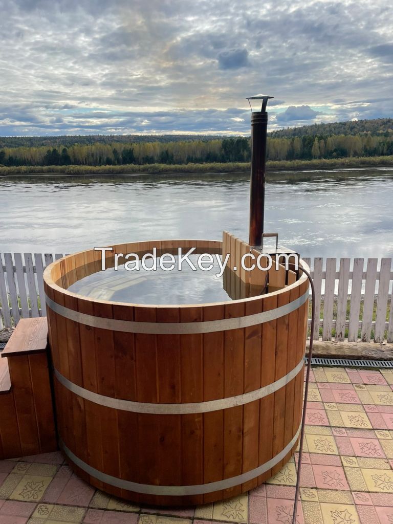 Cedar plungÑƒ tub with submersible wood stove