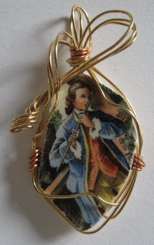 Broken china jewelry pendant with copper wire wrap
