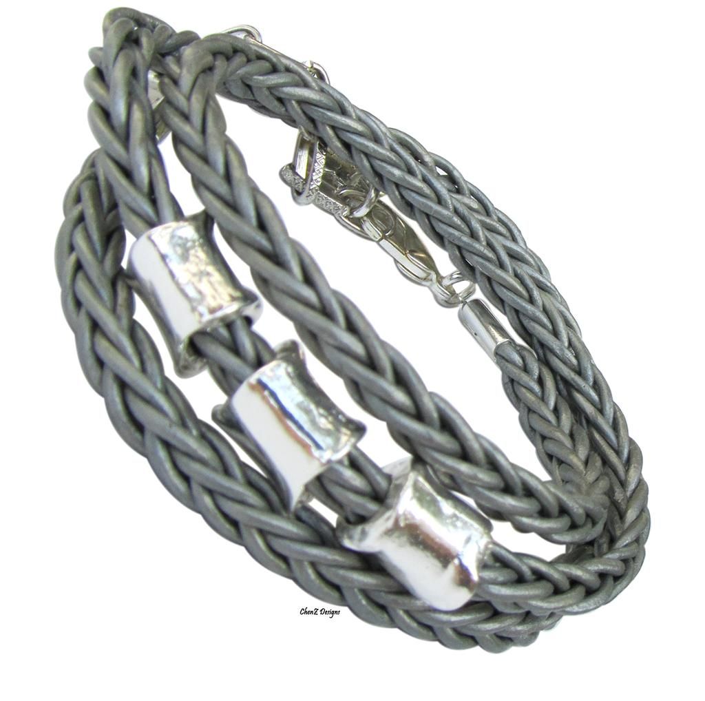 Silver charm bracelet with braid leather
