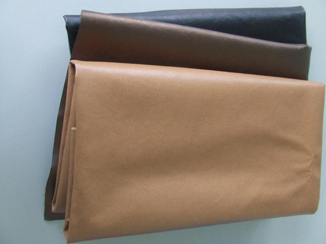 Spunlace nonwoven fabric cross-lapper for synthetic leather substrate