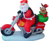 Inflatable Santa and deer sitting on green motor bicycle