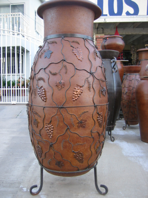big vase with metal grapes and leaves