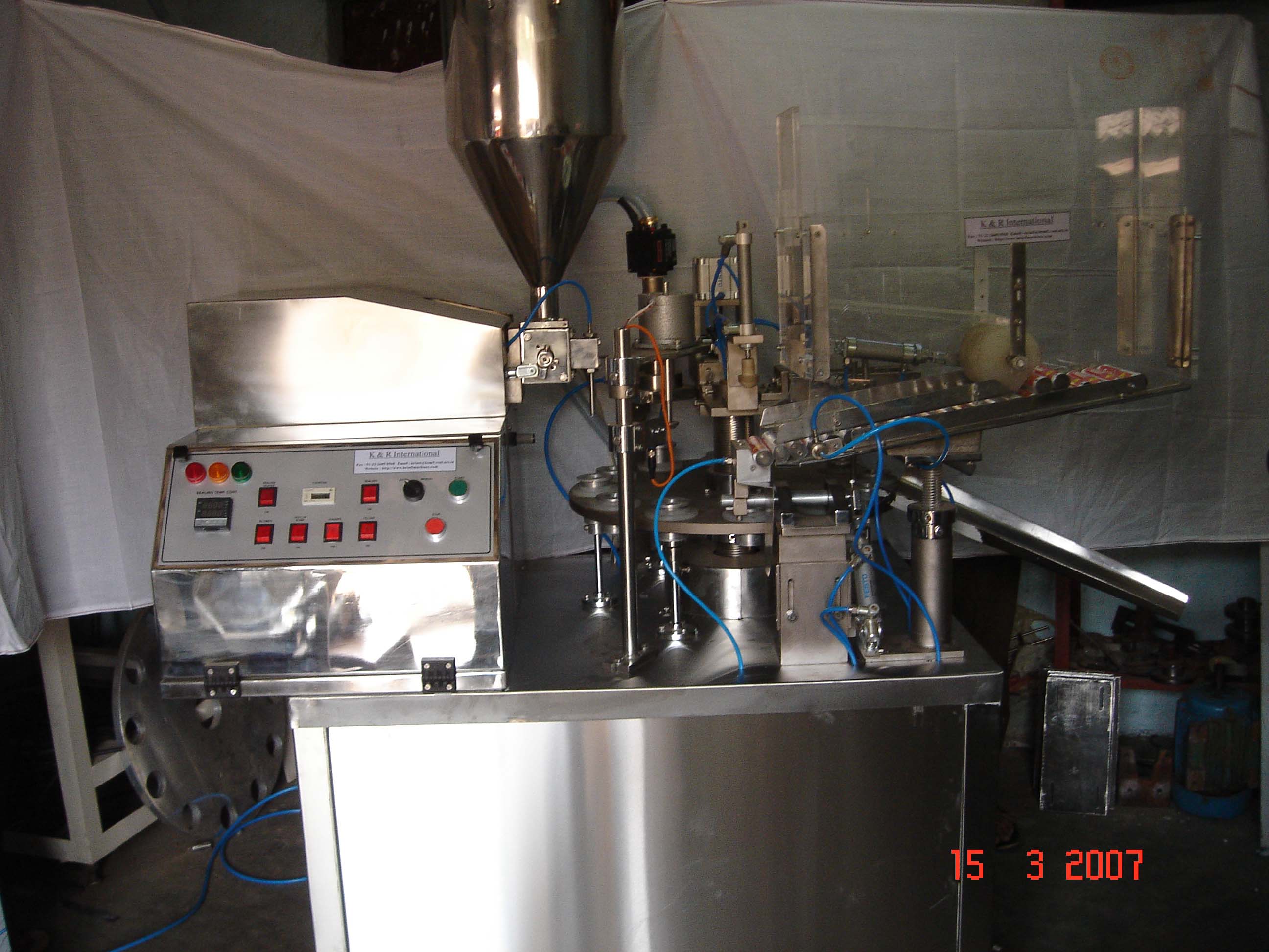 TUBE FILLING SEALING AND CODING MACHINES