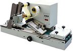 Multi purpose labeller, flap folder and tabber