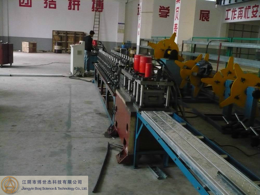 Damper shell roll forming machine