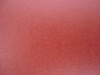 Embossed dyed paper